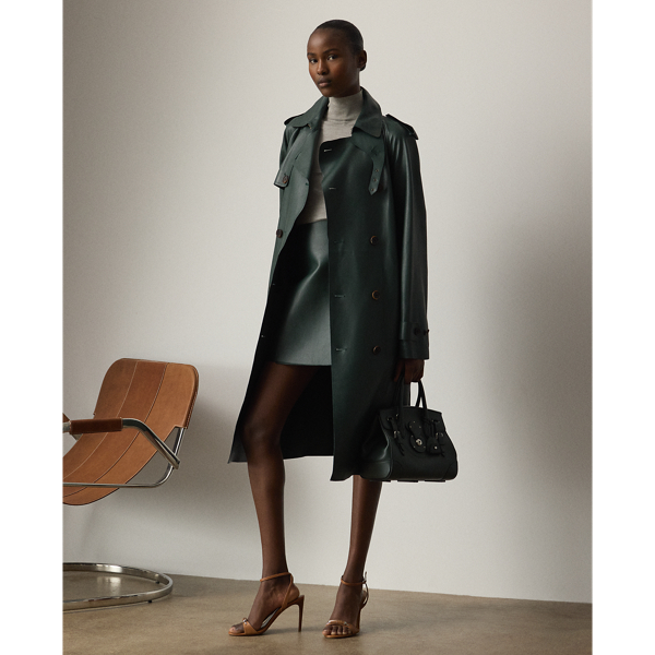 An avid automobile collector, Mr Lauren's vast car collection serves as a key source of inspiration for Pre-Autumn 2025 Collection, which is evident in the Kyler skirt. Cut for a mini A-line silhouette, the Kyler is crafted from supple nappa lambskin in the season's dark racing green hue and detailed with lambskin-trimmed roller buckles in an antiqued brass finish-two design elements directly inspired by one of Mr Lauren's iconic vehicles. A convenient wrap closure offers ease of wear.