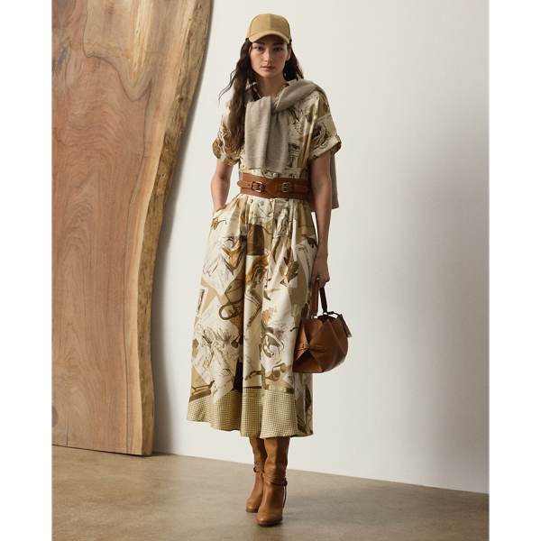 The shirtdress – one of  Ralph Lauren Lauren's most iconic silhouettes – is reinterpreted for Pre-Autumn 2025 as the Donatella day dress. Crafted with silk twill, this style is printed in a renowned Como, Italy, mill with the season's diary-inspired pattern – a beautiful collection of motifs depicting various  Ralph Lauren Lauren sketches and accessories in a versatile, neutral palette. Additional touches, including rolled dolman sleeves, side on-seam pockets and a buckled self-belt, lend to its casual sensibility, while a French placket and calf-grazing silhouette nod to the enduring elegance that defines the house.