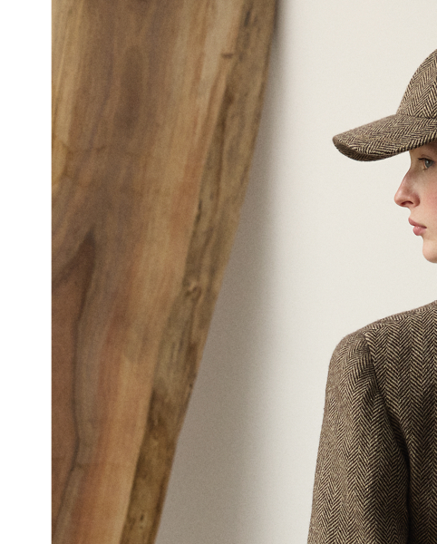 A refreshed rendition of a  Ralph Lauren Lauren icon, the Preston II is updated with a straighter fit and a slightly shorter length. Inspired by one of Mr Lauren's own blazers, this jacket is expertly crafted in Italy with a lightweight, menswear-inspired tweed fabric, which was specially developed with cashmere and silk yarns to achieve an elevated hand feel. Detailed with lamb-suede patches at the elbows, our Preston jacket features a back vent, a throatlatch and a lamb-suede undercollar.