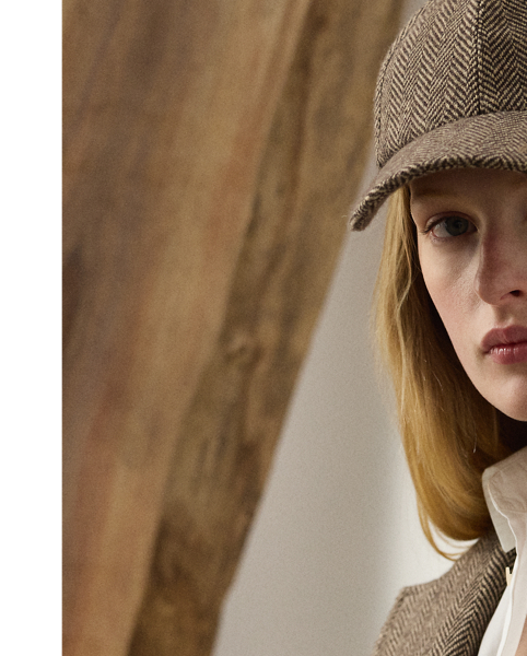 A refreshed rendition of a  Ralph Lauren Lauren icon, the Preston II is updated with a straighter fit and a slightly shorter length. Inspired by one of Mr Lauren's own blazers, this jacket is expertly crafted in Italy with a lightweight, menswear-inspired tweed fabric, which was specially developed with cashmere and silk yarns to achieve an elevated hand feel. Detailed with lamb-suede patches at the elbows, our Preston jacket features a back vent, a throatlatch and a lamb-suede undercollar.