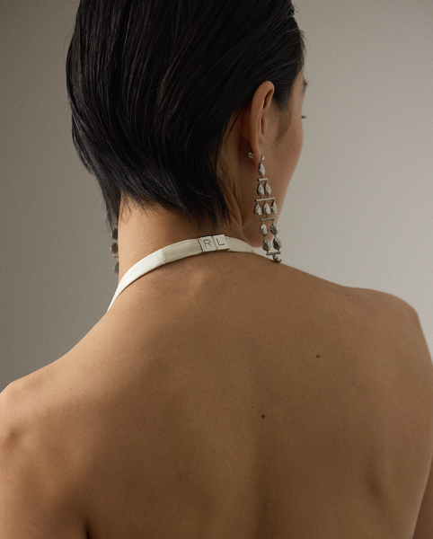 The Cladwell epitomises Mr Lauren's ability to create luxurious looks that are both timeless and modern. Crafted in Italy from full-bodied stretch satin for a fluid drape and perfect sheen, this figure-skimming column dress is distinguished by its dramatic halter silhouette, which easily secures with an "RL"-engraved buckled closure at the centre back of the neck. Featuring a subtle train at the skirt, this evening dress is the definition of understated elegance.