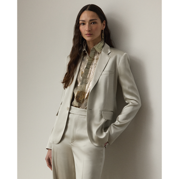 Equestrian-style hacking pockets and genuine mother-of-pearl buttons accent this season's version of the Parker jacket, which is crafted with full-bodied stretch satin for a fluid drape and perfect sheen. Traditional men's tailoring techniques ensure it maintains its slim, waist-defining silhouette for years to come.