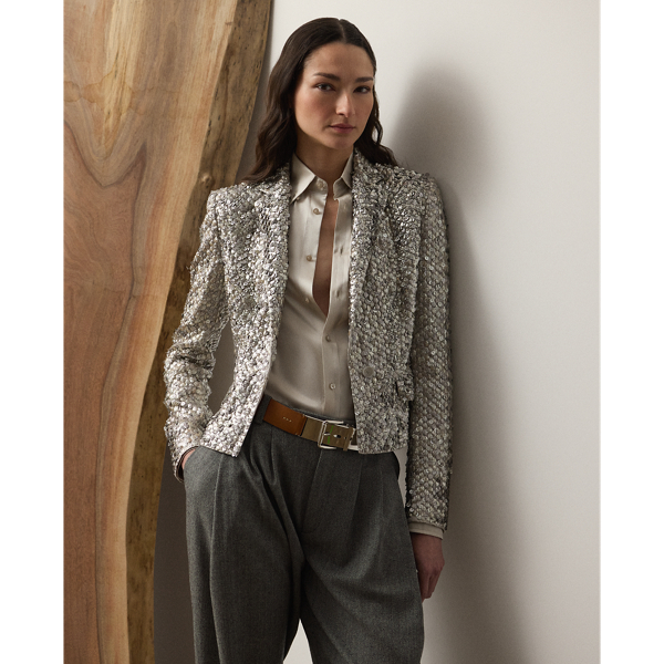 Bringing an effortlessly cool sensibility to traditional tailoring, this novelty jacket is cut for a slim, cropped fit and features notch lapels, a two-button closure and flapped pockets. Starting with an exclusive silk satin base, a team of six highly trained technicians embroidered the Fawn jacket with a mix of round- and oval-shaped metallic sequins, creating rich dimension and texture. Touches of rhinestones are applied throughout, emphasising this style's shimmering effect.
