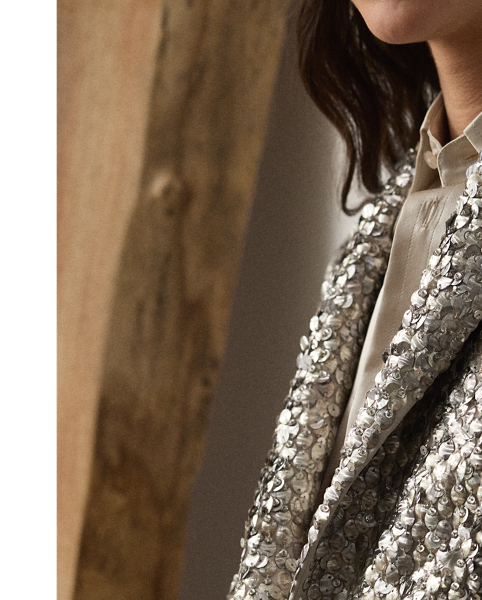 Bringing an effortlessly cool sensibility to traditional tailoring, this novelty jacket is cut for a slim, cropped fit and features notch lapels, a two-button closure and flapped pockets. Starting with an exclusive silk satin base, a team of six highly trained technicians embroidered the Fawn jacket with a mix of round- and oval-shaped metallic sequins, creating rich dimension and texture. Touches of rhinestones are applied throughout, emphasising this style's shimmering effect.