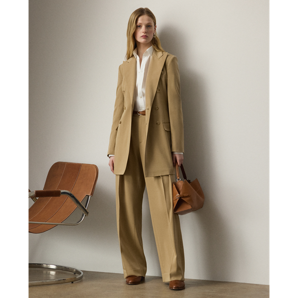 Tailored with pleats, waist darts and crisp creases down each leg, the high-rise Jody trouser is woven with Italian wool trench in a compact weave specially selected for its structured form and stunning drape.