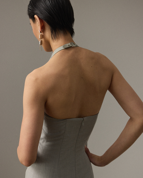 Uniting traditional tailoring with a sporty sensibility, the Kymberly's '90s-inspired mini silhouette features sleek side panels and a halter neckline, which secures with a lamb-suede latch and Ralph Lauren Lauren's iconic stirrup buckle. This sleeveless day dress is crafted with extra-fine worsted wool, selected especially for its brushed, lofty finish and remarkable drape.