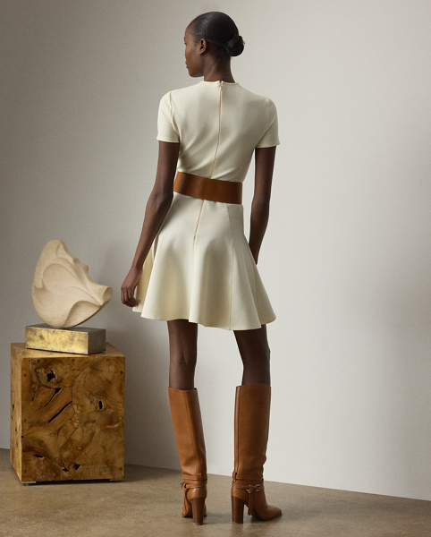 Knit with compact, stretch-infused ponte jersey for a clean, modern look, this day dress embodies the season's theme of understated elegance with a crewneck tee bodice, a dramatic flared skirt and figure-flattering princess seams.
