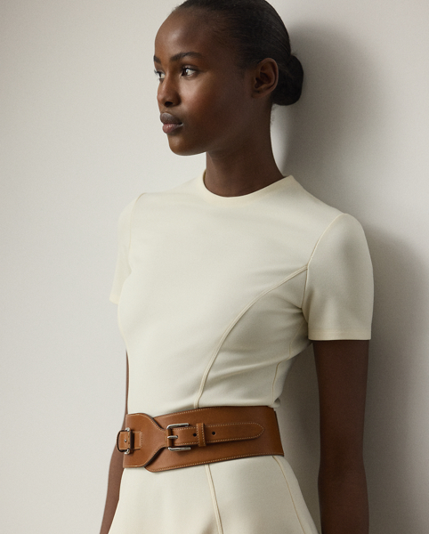 Knit with compact, stretch-infused ponte jersey for a clean, modern look, this day dress embodies the season's theme of understated elegance with a crewneck tee bodice, a dramatic flared skirt and figure-flattering princess seams.