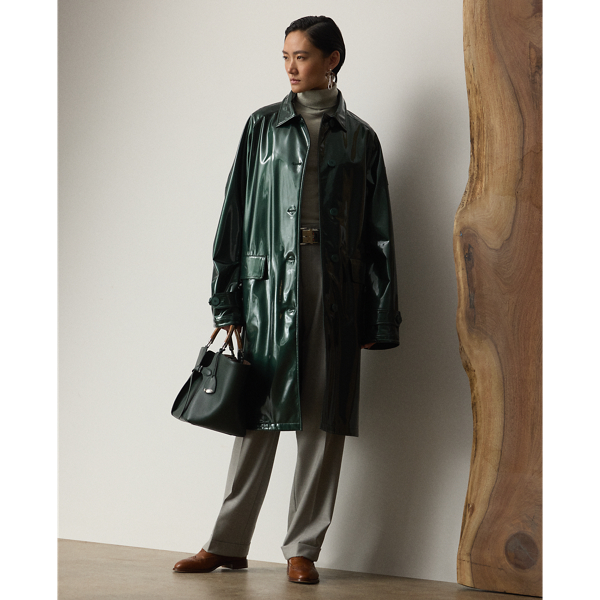 Cut for a slightly oversize fit and knee-grazing length, the Korrina re-imagines the balmacaan coat as an elevated classic inspired by Mr Lauren's impressive car collection. Designed with traditional elements, including raglan sleeves and a single-breasted silhouette, the Korrina is crafted in Italy from a water-repellent synthetic patent leather fabric in the season's dark racing green hue – a lightweight material with a sleek shine and colour inspired by one of Mr Lauren's iconic vehicles. Subtle signature details, including Ralph Lauren Lauren's stacked logo embossed on each sleeve and "RL Ralph Lauren Lauren"-debossed rubber buttons, complete the look.