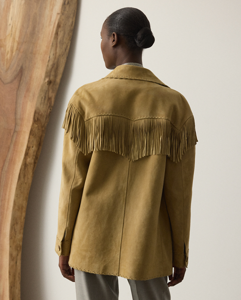 Distinguished by its relaxed, comfortable fit, the Ryland jacket is crafted with sumptuous lamb suede that's tumbled for a vintage, worn-in look. Showcasing Mr Lauren's commitment to fine Italian crafting, this jacket is detailed by hand with whipstitching and fringe trim for a Western-inspired finish.