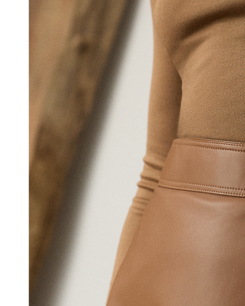 Evoking the sleek, clean aesthetic that defines Pre-Autumn 2025 Collection, the Jackeline midi skirt is cut for a subtle A-line silhouette that hits just below the knee. Designed with a wrap closure that easily secures with an engineered buckled waistband and an interior snapped closure, this timeless style is crafted in Italy from supple nappa lambskin that's specially dyed and finished to achieve its rich coloring.