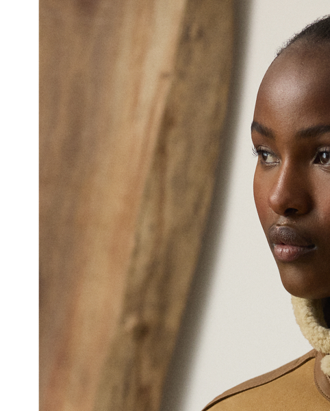 Inspired by traditional flight jackets, the Morrison coat is crafted from a luxurious combination of textures, including soft, ultra-lightweight wool shearling, which displays a semi-curly interior and a smooth suede exterior, and supple lambskin taping for a sophisticated yet dynamic contrast, which enhances the relaxed-fitting design of this coat. Additional details, including a lambskin buckled throatlatch, rib-knit cuffs and hem, and lambskin flapped pockets, complete the look.