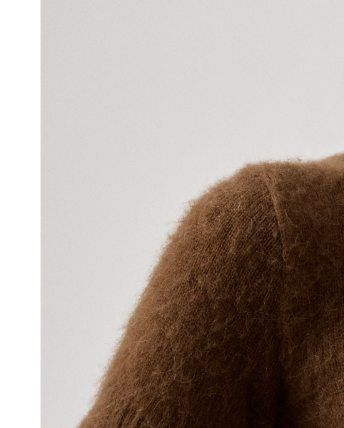 Distinguished by its cropped silhouette, this short-sleeve jumper is spun with a luxurious cashmere-and-alpaca-blend yarn, which is specially brushed to achieve a textural, remarkably soft hand feel. Rib-knit trim and a rich cognac hue complete the look.