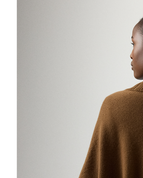 An elegant layering piece, this cape-style jumper is spun with medium-weight cashmere jersey and features a shawl collar, elbow-length sleeves and rib-knit trim.
