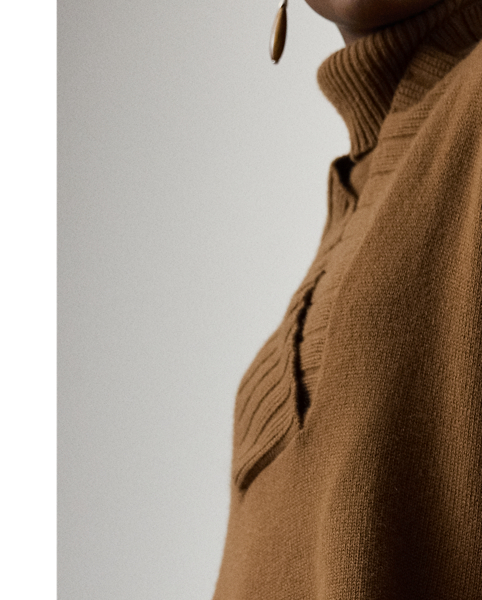 An elegant layering piece, this cape-style jumper is spun with medium-weight cashmere jersey and features a shawl collar, elbow-length sleeves and rib-knit trim.