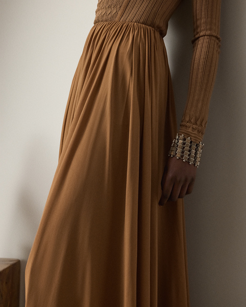 Crafted from fluid crepe jersey, this calf-grazing skirt features delicate shirring for a beautiful texture and ease of movement.