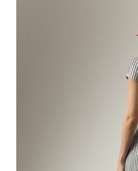 Artfully spun with plaited silk yarns, this jumper day dress is designed with directional ribbing that accentuates the hips and waist. A tee-style bodice offers a casual feel, while a foil-print technique is used to create a beautiful, subtle shimmer.