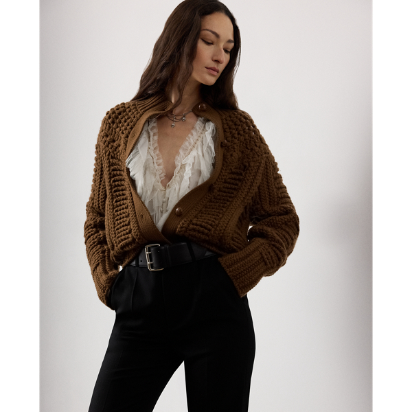 A favourite of Mr Lauren's this season, this version of our cashmere cardigan jumper undergoes a multi-step artisanal process to achieve its cosy design. To begin, a hand-crochet knitting technique forms the novelty stitch pattern at the yoke. Next, a special Machine is used to create the textural, three-dimensional stitching displayed at the bodice and sleeves. Finally, the pieces are sewn together to form this style's relaxed silhouette. Braided leather buttons at the placket complete the look.