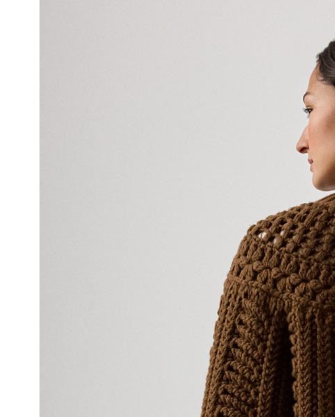 A favourite of Mr Lauren's this season, this version of our cashmere cardigan jumper undergoes a multi-step artisanal process to achieve its cosy design. To begin, a hand-crochet knitting technique forms the novelty stitch pattern at the yoke. Next, a special Machine is used to create the textural, three-dimensional stitching displayed at the bodice and sleeves. Finally, the pieces are sewn together to form this style's relaxed silhouette. Braided leather buttons at the placket complete the look.