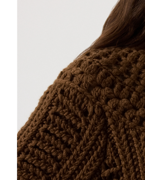 A favourite of Mr Lauren's this season, this version of our cashmere cardigan jumper undergoes a multi-step artisanal process to achieve its cosy design. To begin, a hand-crochet knitting technique forms the novelty stitch pattern at the yoke. Next, a special Machine is used to create the textural, three-dimensional stitching displayed at the bodice and sleeves. Finally, the pieces are sewn together to form this style's relaxed silhouette. Braided leather buttons at the placket complete the look.