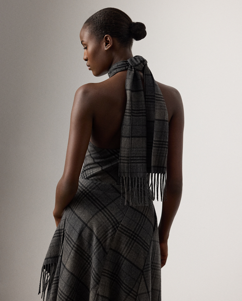 Re-imagining Ralph Lauren Lauren's iconic Chilton dress as a sleeveless blouse, this top showcases Mr Lauren's ability to transform timeless silhouettes into modern designs. Crafted in Italy from the season's fibre-dyed plaid wool fabric for a soft, lightweight feel, this blouse is distinguished by a halter neckline with a fringe-trimmed self-tie scarf.
