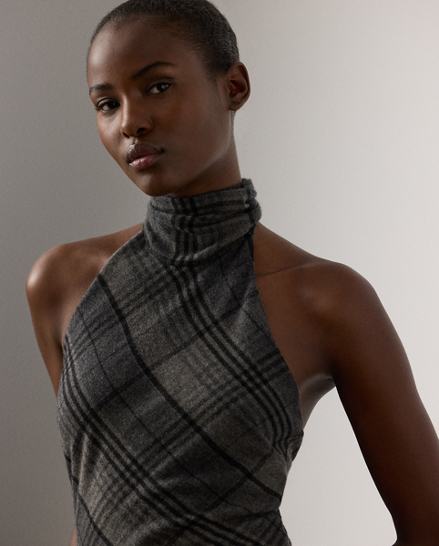 Re-imagining Ralph Lauren Lauren's iconic Chilton dress as a sleeveless blouse, this top showcases Mr Lauren's ability to transform timeless silhouettes into modern designs. Crafted in Italy from the season's fibre-dyed plaid wool fabric for a soft, lightweight feel, this blouse is distinguished by a halter neckline with a fringe-trimmed self-tie scarf.