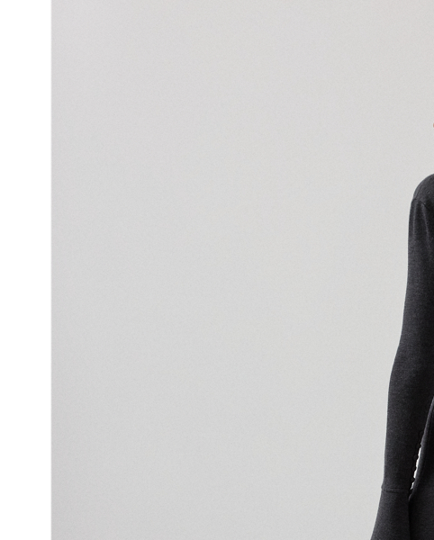 This slim-fitting style re-imagines the classic Polo shirt as a calf-grazing day dress with long sleeves. Featuring a Polo collar, bell cuffs and fabric-covered buttons, this dress is knit with lightweight interlock jersey – a fabrication created with 100% virgin wool and esteemed for its unique balance of structure, softness and fluidity.