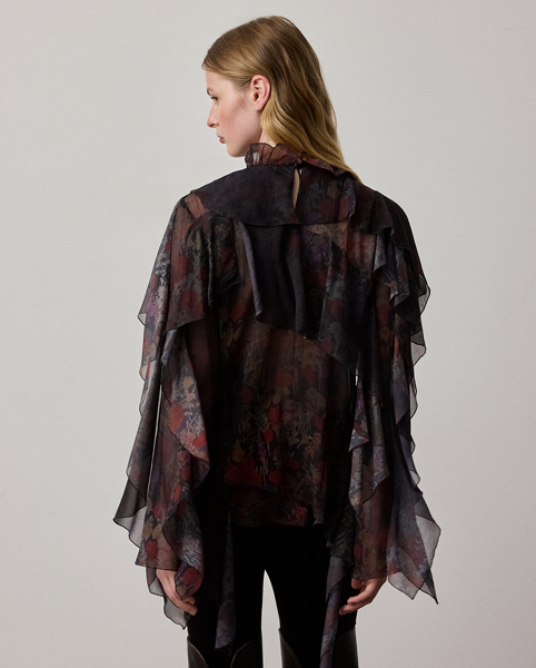 For the Autumn 2025 Collection, Mr Lauren has paired the romantic elements iconic to the Victorian era with modern silhouettes, as evident here in the Ilene blouse. Distinguished by cascading, bias-cut ruffles, this relaxed-fitting top is crafted in Italy from airy crinkle chiffon printed with one of the season's dark floral motifs, which features a smoky effect for subtle movement with each step.