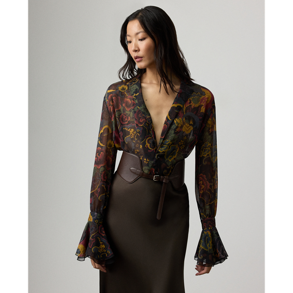 For the Autumn 2025 Collection, Mr Lauren has paired the romantic elements iconic to the Victorian era with modern silhouettes, as evident here in the Jolie blouse. Crafted in Italy from delicate crinkle chiffon, this top is printed in a renowned Como-based mill with one of the season's jewel-tone motifs – a dreamy collage of flowers and paisleys. With blouson sleeves and ruffled cuffs, this elegant style is detailed with genuine mother-of-pearl buttons and a slender camp collar.