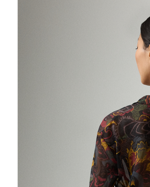 For the Autumn 2025 Collection, Mr Lauren has paired the romantic elements iconic to the Victorian era with modern silhouettes, as evident here in the Jolie blouse. Crafted in Italy from delicate crinkle chiffon, this top is printed in a renowned Como-based mill with one of the season's jewel-tone motifs – a dreamy collage of flowers and paisleys. With blouson sleeves and ruffled cuffs, this elegant style is detailed with genuine mother-of-pearl buttons and a slender camp collar.