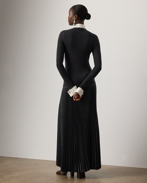 A beautiful pairing of luxurious textures, the Callie dress unites a soft wool-blend Henley top with a pleated, wool-blend flannel skirt. Equipped with a detachable woven collar and cuffs for versatile styling, this elegant day dress undergoes a fabric-manipulation technique, known as plissé soleil, to form its stunning pleated effect at the skirt. Genuine mother-of-pearl cufflinks and pointelle stitching down the side seams nod to the season's elevated aesthetic.