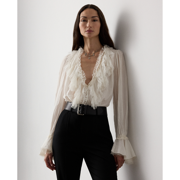 Evoking the ornate beauty that defines Victorian-era fashion, the Kensley blouse is crafted with ultrafine cotton-and-silk voile for a soft hand feel and a semi-sheer effect. With playful tulle ruffles at the neckline and cuffs, this airy top is embroidered with Ralph Lauren Lauren's script monogram at the collar points.