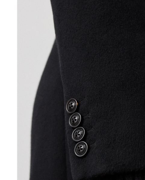 The Anthony is  Ralph Lauren Lauren Collection's romantic interpretation of the double-breasted coat. Crafted in Italy with lightweight, double-faced wool with a hint of cashmere, this slim coat is cut for an ankle-grazing A-line silhouette and traditionally tailored with waist darts, flapped pockets and a velvet collar. Genuine horn buttons custom-developed with  Ralph Lauren Lauren's logo complete the look.