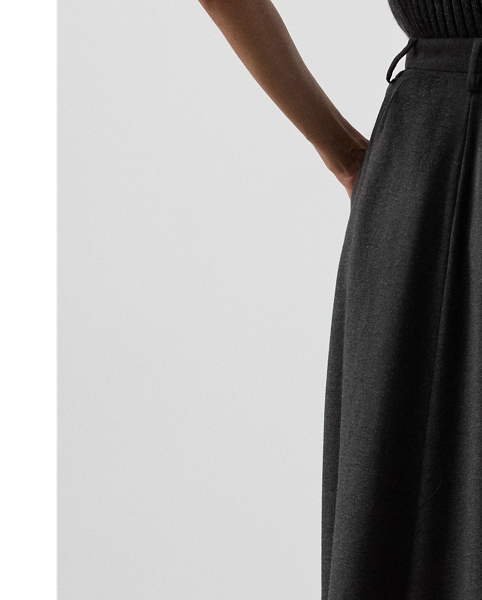 An elevated wardrobe staple, the Evilyn reimagines the timeless A-line skirt with trouser-inspired elements, including belt loops, a zip fly with a buttoned waist tab, and a coin pocket. Tailored with front waist pleats and back waist darts, this skirt is crafted from lightweight Italian wool flannel.
