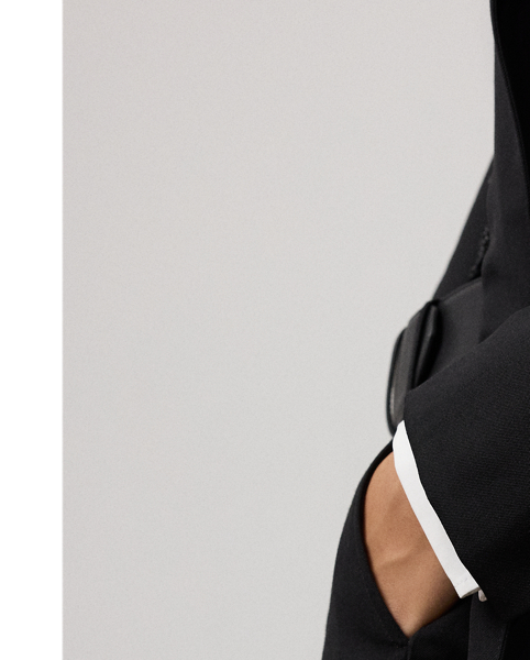 A refreshed rendition of a  Ralph Lauren Lauren icon, the Varick reimagines our signature Kent jacket with a longer, thigh-grazing length. Traditionally tailored with waist darts and shoulder pads, this double-breasted blazer is rendered in the season's classic grain de poudre fabric, which is woven with high-twist, ultrafine wool yarn that offers a clean finish and a crisp-yet-soft hand feel.