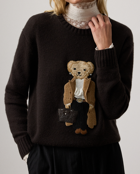 For Autumn 2025, Mr Lauren was inspired by the intricate beauty of Victorian-era designs, which is evident in the season's Autumn Polo Bear cashmere jumper. Four specialised technicians created the Polo Bear patch using a mix of embroidery techniques and a collection of highly considered materials, including a rich wool blend for the coat, soft cotton-and-silk voile for the blouse, wool flannel for the trousers, faux leather for the shoes and belt and dry-cleanable lambskin for the Ricky bag. Additional details, including embroidered neck lace and a special thread technique for the pinstripes and rodeo buckle, nod to the season's focus on the finer details.