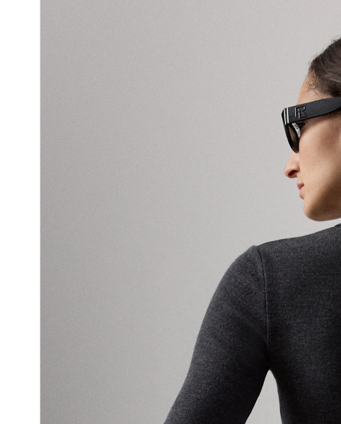 This timeless style reimagines the classic Polo shirt as a slim-fitting top with elbow-length sleeves. Featuring a rib-knit Polo collar and genuine mother-of-pearl buttons custom-developed with  Ralph Lauren Lauren's logo, this top is knit with lightweight interlock jersey – a fabrication created with 100% virgin wool and considered for its unique balance of structure, softness and fluidity.