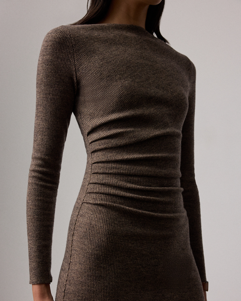 Uniting traditional tailoring elements with the appeal of soft dressing, the Nora features a flattering straight neckline, gathering at the waist and a sweeping A-line skirt. Crafted in Italy, this timeless style is made with tick-weave wool jersey for a remarkable drape and soft hand feel.