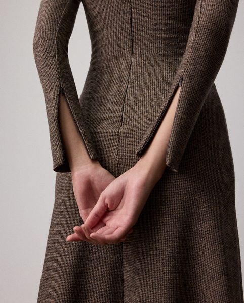 Uniting traditional tailoring elements with the appeal of soft dressing, the Nora features a flattering straight neckline, gathering at the waist and a sweeping A-line skirt. Crafted in Italy, this timeless style is made with tick-weave wool jersey for a remarkable drape and soft hand feel.