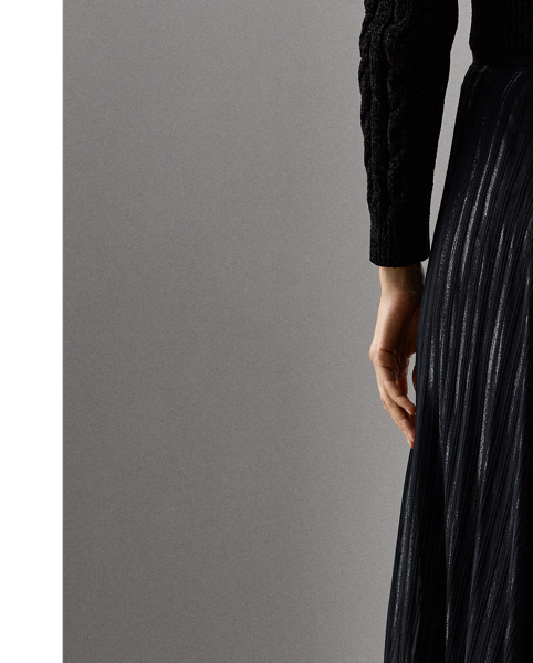 Cut for a floor-sweeping length, the Carlita skirt is crafted from airy jacquard, which is made on a silk chiffon base with contrasting wool and metallic stripes for a semi-sheer, semi-glossy effect.