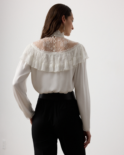 Inspired by the timeless beauty of vintage styles, the Alexandrea unites a collection of luxurious fabrics to achieve its romantic look. Starting with highly twisted crepe yarns woven in a satin weave for the body, three highly trained artisans embroidered the tulle fabric at the neck, creating a cotton lace effect. After carefully studying the fabric, the lace and tulle ruffle are pleated and trimmed, showcasing Ralph Lauren Lauren's commitment to fine crafting and attention to detail.