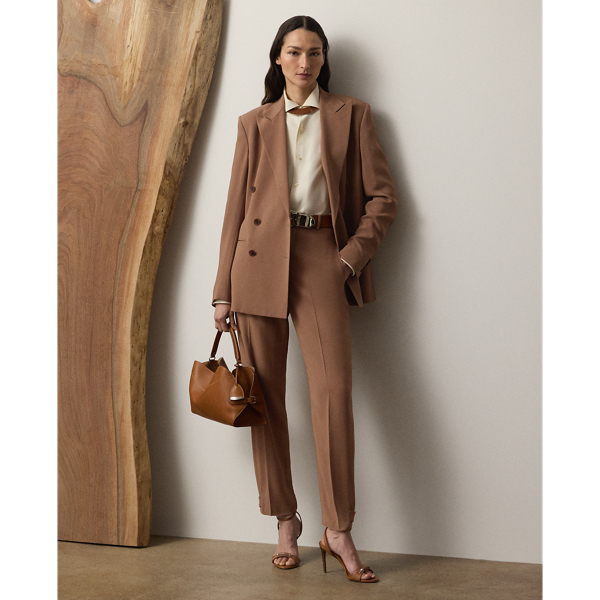 The Gillian trouser is crafted in Italy from a soft, delicate cady fabrication, for which highly twisted crepe yarns are woven with moderate stretch, resulting in a supple, fluid drape and a lightweight feel. Crisp creases and genuine horn buttons adorn these timeless trousers, which are designed with buttoned tabs on the hems for a more tapered fit.