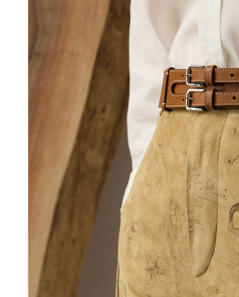 The Gillian trouser is crafted in Italy from sumptuous lamb suede, which is specially printed with one of the season's equestrian-inspired motifs – a soft, understated pattern depicting horses, riding equipment and hints of paisley. Crisp creases and genuine horn buttons adorn these timeless trousers, which are designed with buttoned tabs on the hems for a more tapered fit.