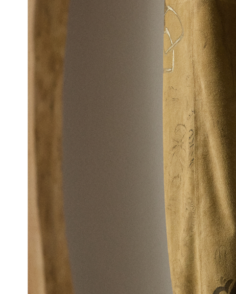 The Gillian trouser is crafted in Italy from sumptuous lamb suede, which is specially printed with one of the season's equestrian-inspired motifs – a soft, understated pattern depicting horses, riding equipment and hints of paisley. Crisp creases and genuine horn buttons adorn these timeless trousers, which are designed with buttoned tabs on the hems for a more tapered fit.