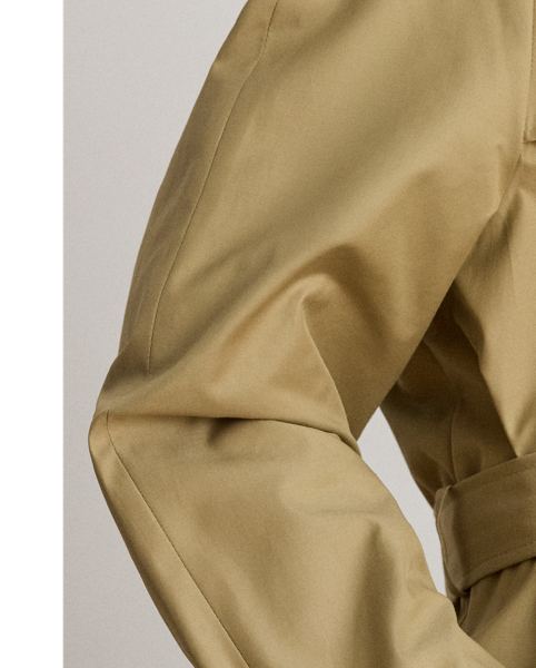 A buckled self-belt enhances the streamlined silhouette of this double-breasted trench coat, which is tailored from a lightweight cotton blend. Buttoned shoulder epaulettes and “Lauren  Ralph Lauren Lauren”-engraved horn-effect buttons amp up its sophisticated appeal, while storm flaps and a water-resistant shell protect you from inclement weather.