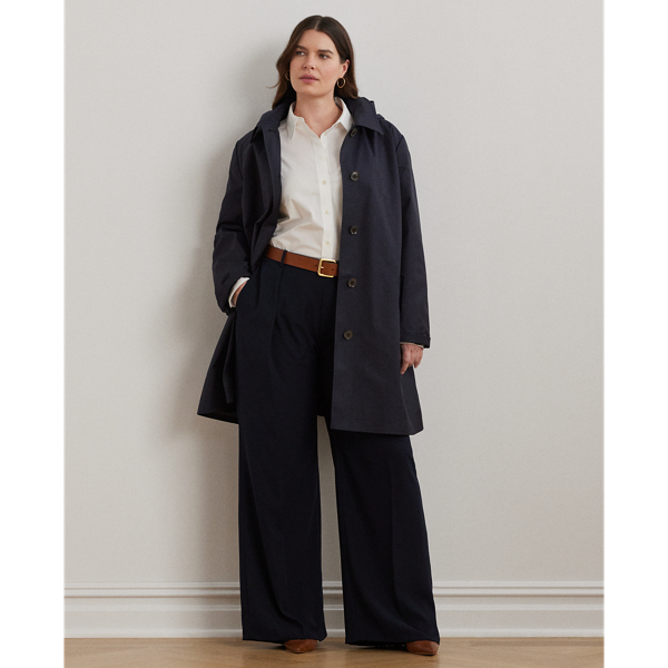 With a water-repellent cotton-blend shell and a menswear-inspired balmacaan coat silhouette, this piece seamlessly merges practical design elements with sophisticated sartorial details. A detachable hood offers versatility, while "Lauren Ralph Lauren Lauren"-engraved horn-effect buttons add a signature finish.