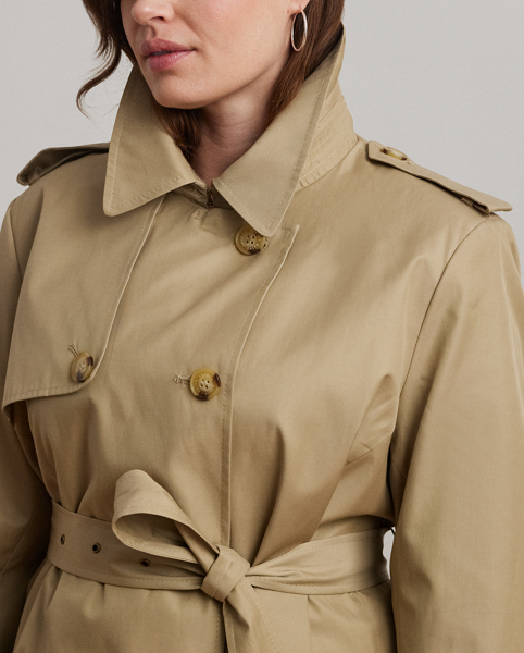Rendered in a soft cotton blend, Lauren's take on the trench coat showcases traditional styling details, including a double-breasted silhouette and buttoned shoulder epaulets. A buckled self-belt accentuates the waist, while "Lauren Ralph Lauren Lauren"-engraved horn-effect buttons lend a signature finish.
