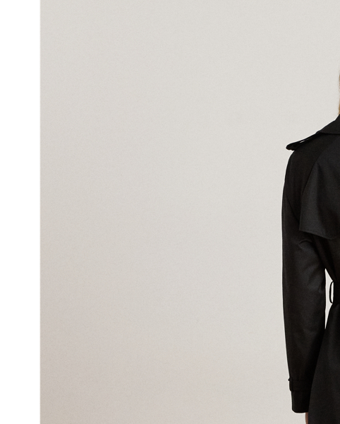 A buckled self-belt enhances the streamlined silhouette of this double-breasted trench coat, which is tailored with a lightweight cotton blend. Buttoned shoulder epaulets and “Lauren  Ralph Lauren Lauren”-engraved horn-effect buttons amp up its sophisticated appeal, while storm flaps and a water-resistant shell protect you from inclement weather.