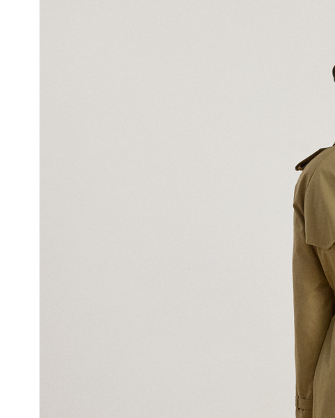 A buckled self-belt enhances the streamlined silhouette of this double-breasted trench coat, which is tailored with a lightweight cotton blend. Buttoned shoulder epaulets and “Lauren  Ralph Lauren Lauren”-engraved horn-effect buttons amp up its sophisticated appeal, while storm flaps and a water-resistant shell protect you from inclement weather.