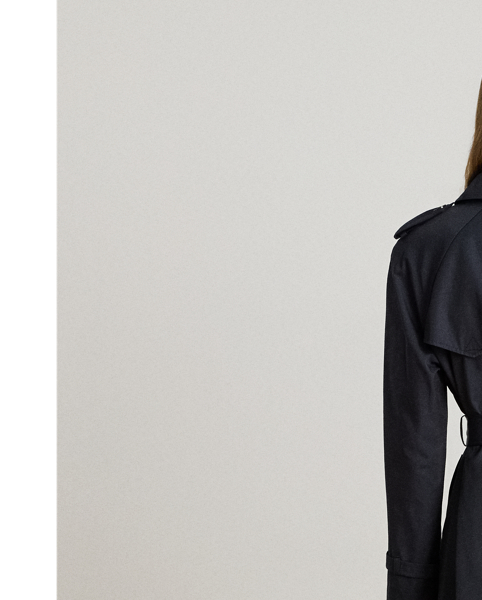 A buckled self-belt enhances the streamlined silhouette of this double-breasted trench coat, which is tailored with a lightweight cotton blend. Buttoned shoulder epaulets and “Lauren  Ralph Lauren Lauren”-engraved horn-effect buttons amp up its sophisticated appeal, while storm flaps and a water-resistant shell protect you from inclement weather.